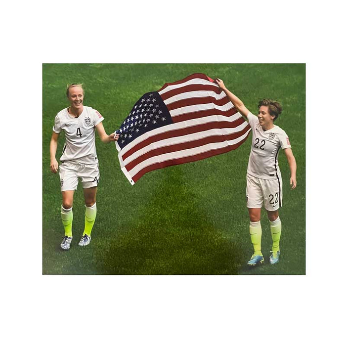 Meghan Klingenberg and Becky Sauerbrunn Holding US Flag (down view) Unsigned 16x20 Photo