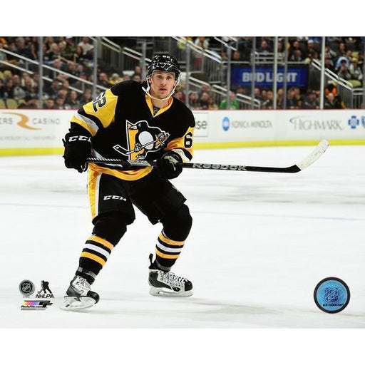 Bryan Rust Pittsburgh Penguins Unsigned Gold Alternate Jersey Skating vs. Boston Bruins Photograph