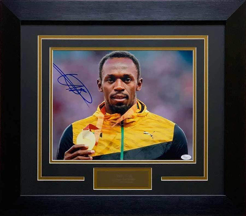 Usain Bolt Autographed Close-up Holding Medal 11x14 - Professionally Framed